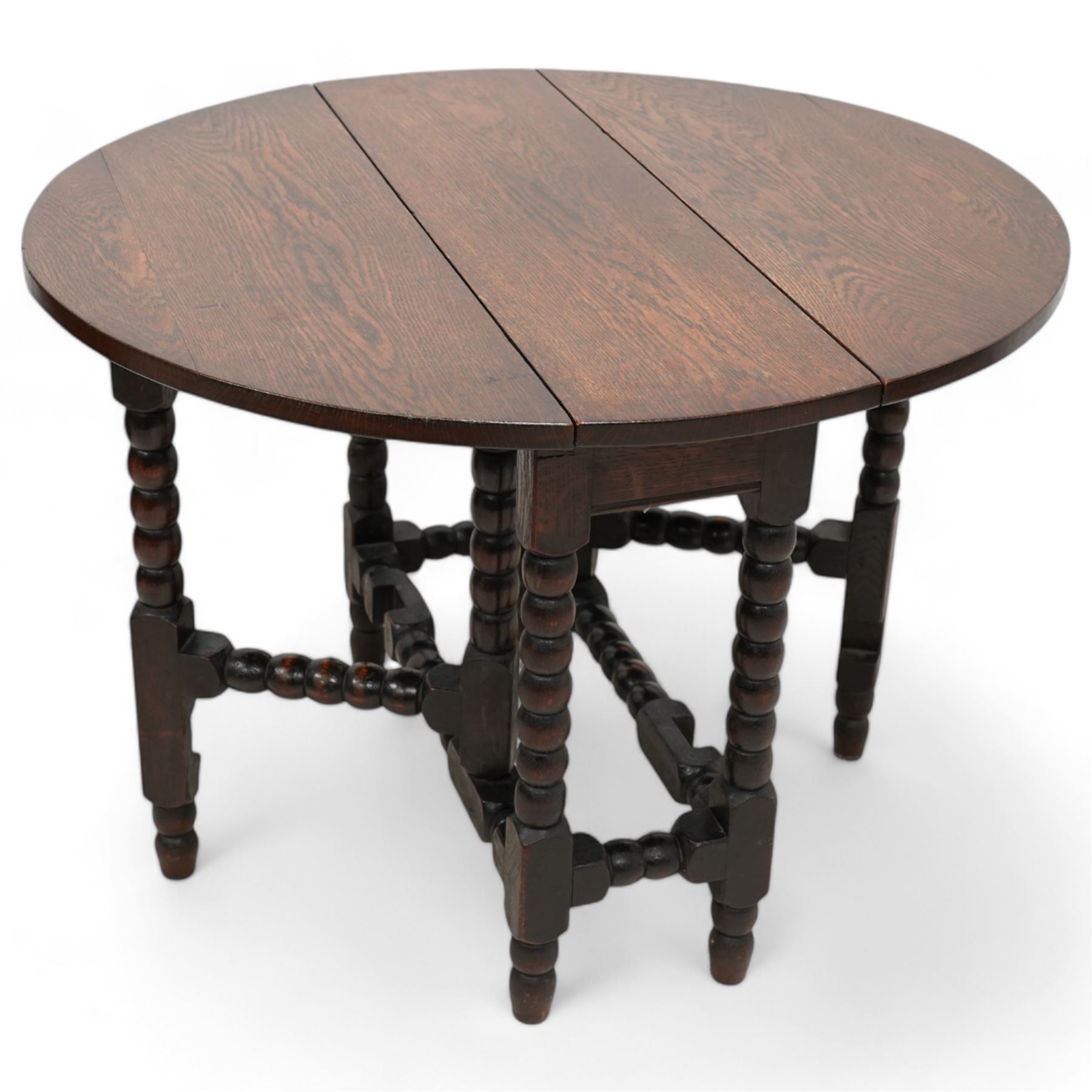 Small 17th century design oak drop-leaf, table oval top over bobbin-turned gate-leg supports, united by stretchers