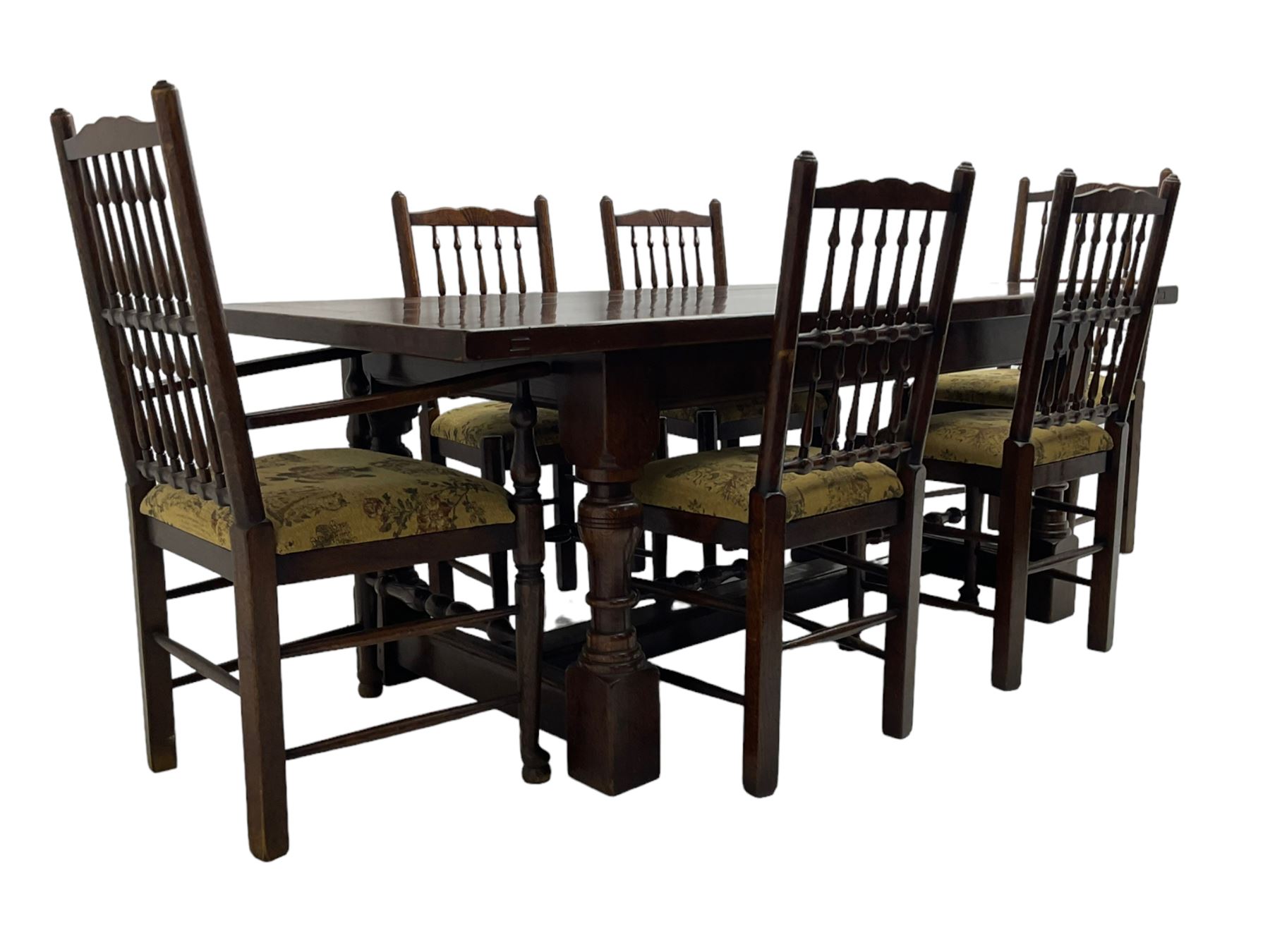 Oak refectory dining table, rectangular cleated top on turned supports joined by H-stretcher; together with set of six (4+2) oak spindle back dining chairs, with upholstered drop-on seat cushions, turned supports joined by turned stretchers