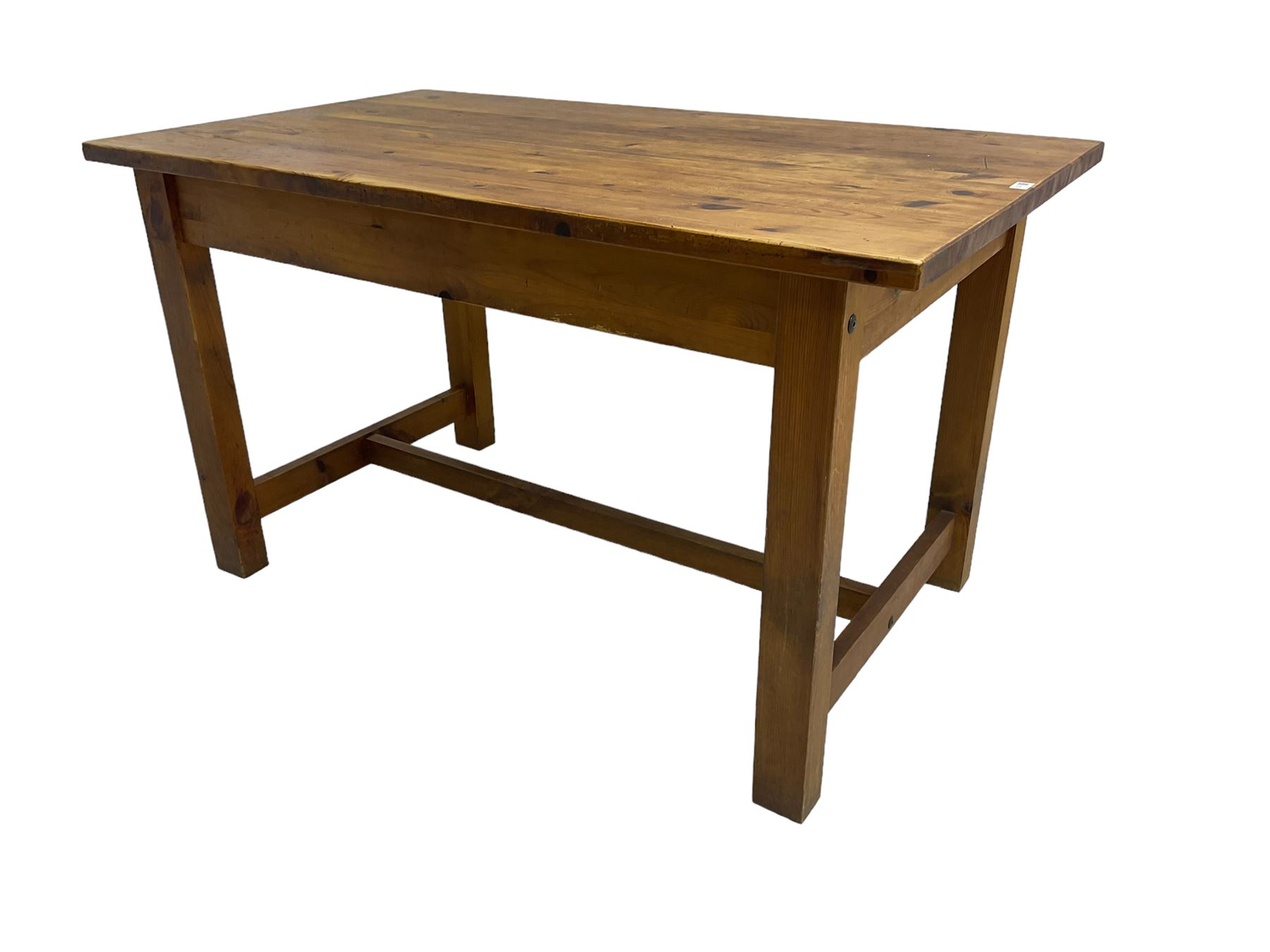 Traditional waxed pine kitchen or dining table, rectangular top over square supports united by H-stretcher