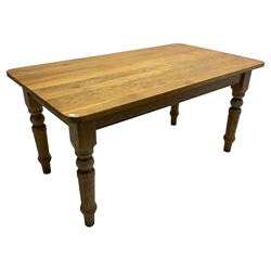 Limed oak dining table, rectangular top with rounded corners, on turned supports