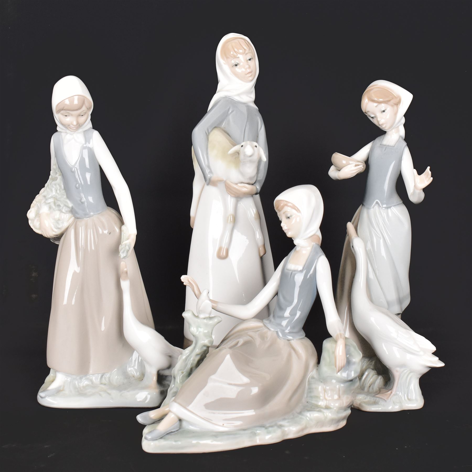 Four Lladro figures, including Girl with Lamb, Girl with Dove etc