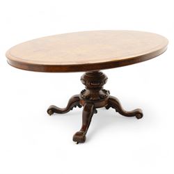 Victorian figured walnut breakfast or centre table, moulded oval top with figured quarter-...