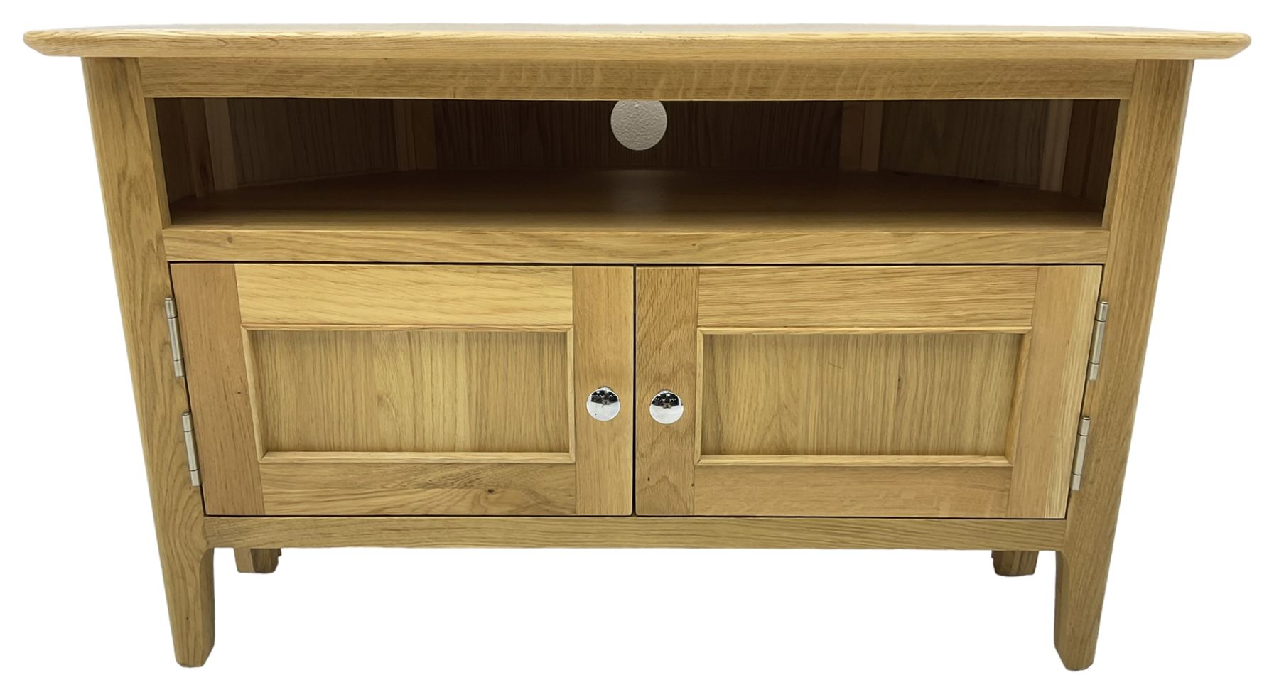 Contemporary light oak corner television stand, hexagonal top over recessed shelf, fitted with two panelled cupboard doors with chrome handles, on straight supports with rounded inner edges