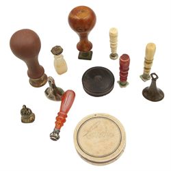 Georgian and later desk and fob seals including a carnelian handled and embossed white metal seal, two bone handled examples, agate seal, two cased wax seals etc 