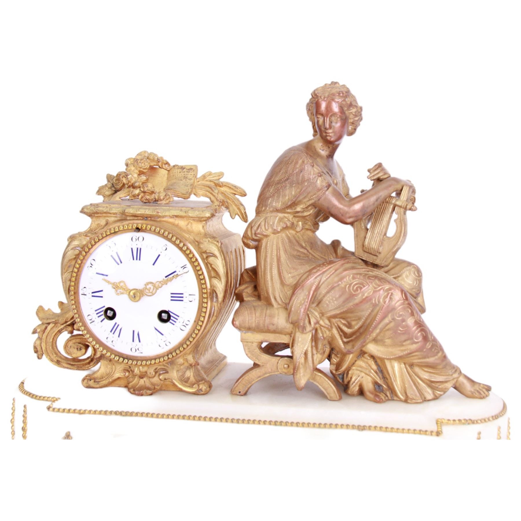 French - late 19th century 8-day figural mantle clock c 1880, with a breakfront alabaster plinth raised on four conforming feet, with two recessed and three raised lozenge panels, continuous bead decoration and a cast gilt figure of a seated female playing a Lyre,  Parisian drum movement with an enamel dial and Roman numerals, five-minute Arabic's and gilt Louis XVI hands, twin train countwheel striking movement, striking the hours and half-hours on a bell. With Pendulum. 