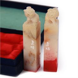 Pair of Chinese carved soapstone seals with temple dog finials, boxed, seal H8cm