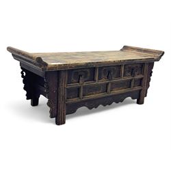 Mid-19th century elm low altar table, rectangular top with scrolled ends, fitted with thre...