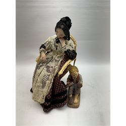 Anna Meszaros (Hungarian 1905-1998): 'My Great Granny', handmade needlework figurine, together with small plaster cast of a young boy by the same artist, granny H30cm
Auctioneer's Note: Anna Meszaros came to England from her native Hungary in 1959 to marry an English businessman she met while demonstrating her art at the 1958 Brussels Exhibition. Shortly before she left for England she was awarded the title of Folk Artist Master by the Hungarian Government. Anna was a gifted painter of mainly portraits and sculptress before starting to make her figurines which are completely hand made and unique, each with a character and expression of its own. The hands, feet and face are sculptured by layering the material and pulling the features into place with needle and thread. She died in Hull in 1998