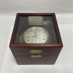 Two-day marine chronometer, with silvered dial inscribed Thomas Mercer Ltd, St Albans, contained within a brass gimbal-mounted bowl and glazed mahogany case, with applied brass plaque reading 'supplied by Kelvin Hughes no. 24295', brass winding key and two service notes to interior of case, dial D12cm, wooden case H17.5cm 