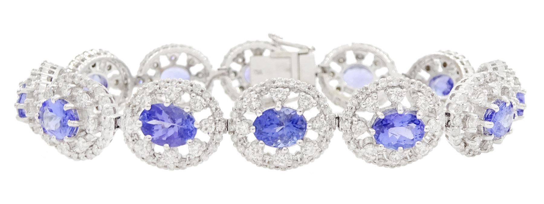 18ct white gold tanzanite and diamond bracelet, twelve oval link clusters set with oval cut tanzanite's and round brilliant cut diamonds, stamped 750, total tanzanite weight approx 11.00 carat, total diamond weight approx 3.65 carat