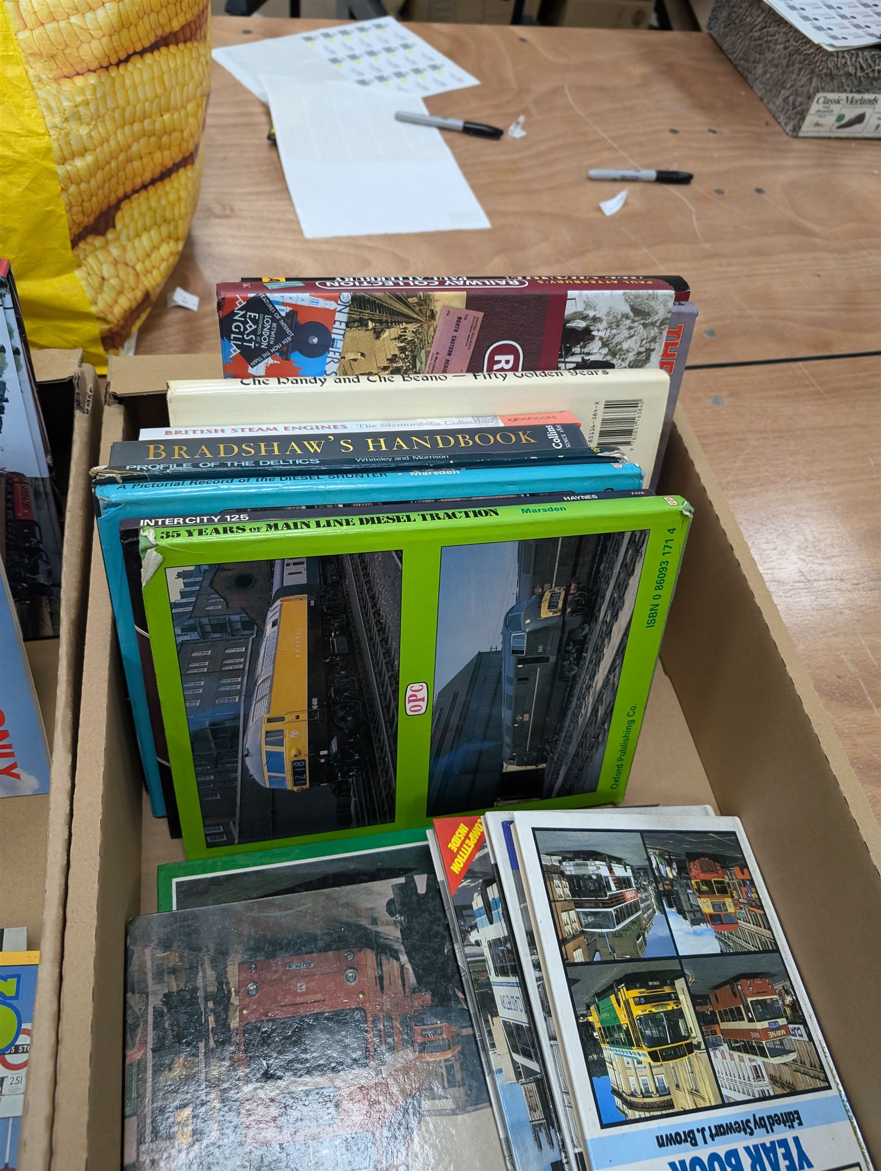 Railway and transport reference books, including several editions of Buses Year Book 1981-1992, in two boxes