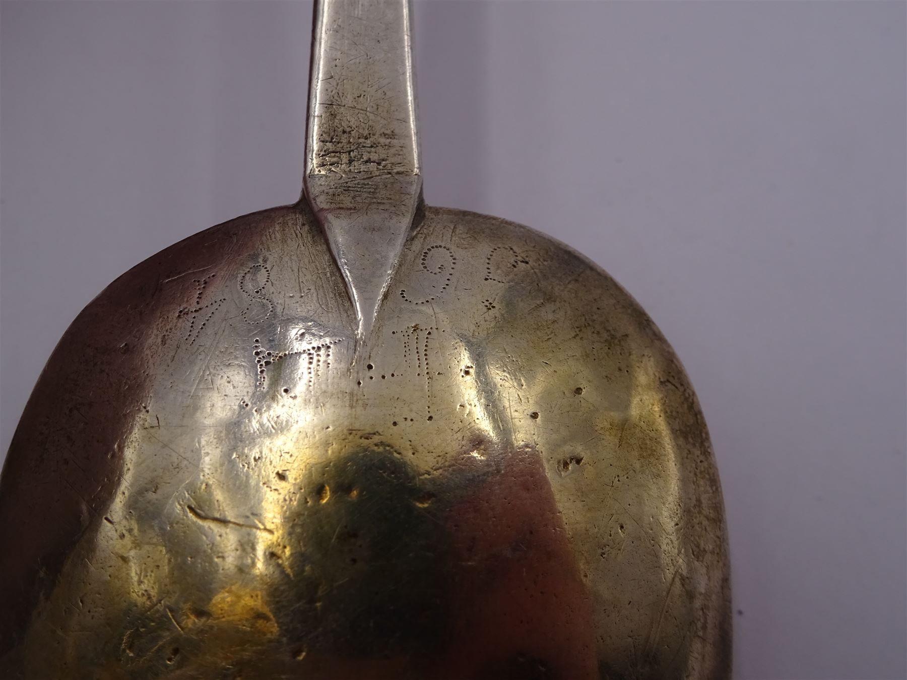 17th century silver trifid spoon, marks worn and indistinct, together with an Old English pattern silver spoon