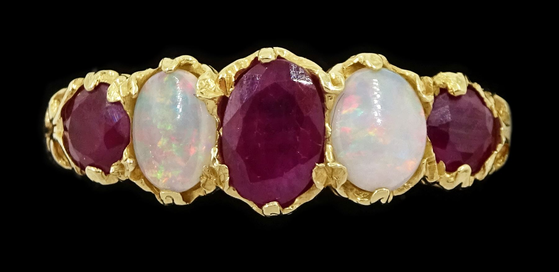 14ct gold five stone oval cut ruby and opal ring, London 2006