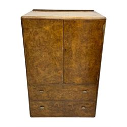 Early 20th century burr walnut cabinet, rectangular top with raised back, over double-door cupboard enclosing camphor interior with single shelf, lower section fitted with two drawers