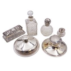 Edwardian silver mounted capstan inkwell, hallmarked A & J Zimmerman Ltd, Birmingham 1905, together with a group of silver mounted cut glass items including scent bottles, mustard pot and dressing table jars with silver collars/lids, all hallmarked 