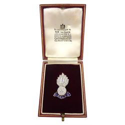 Platinum rose cut diamond Royal Artillery flaming grenade brooch, with 9ct gold blue enamel 'Ubique' motto below, in Garrard & Co Ltd silk and velvet lined case