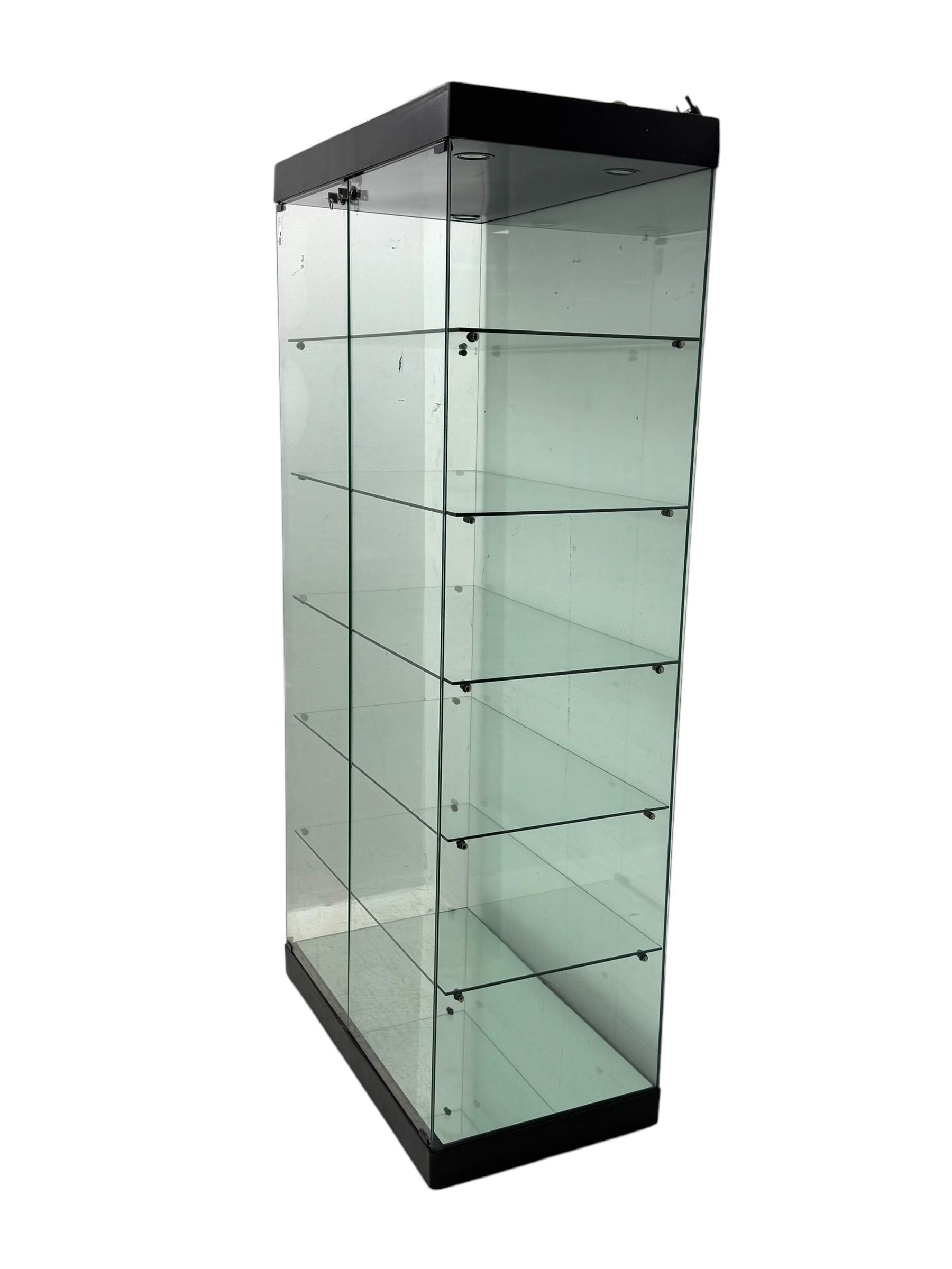 Glazed shop display cabinet fitted with two doors, six shelves with illuminated interior