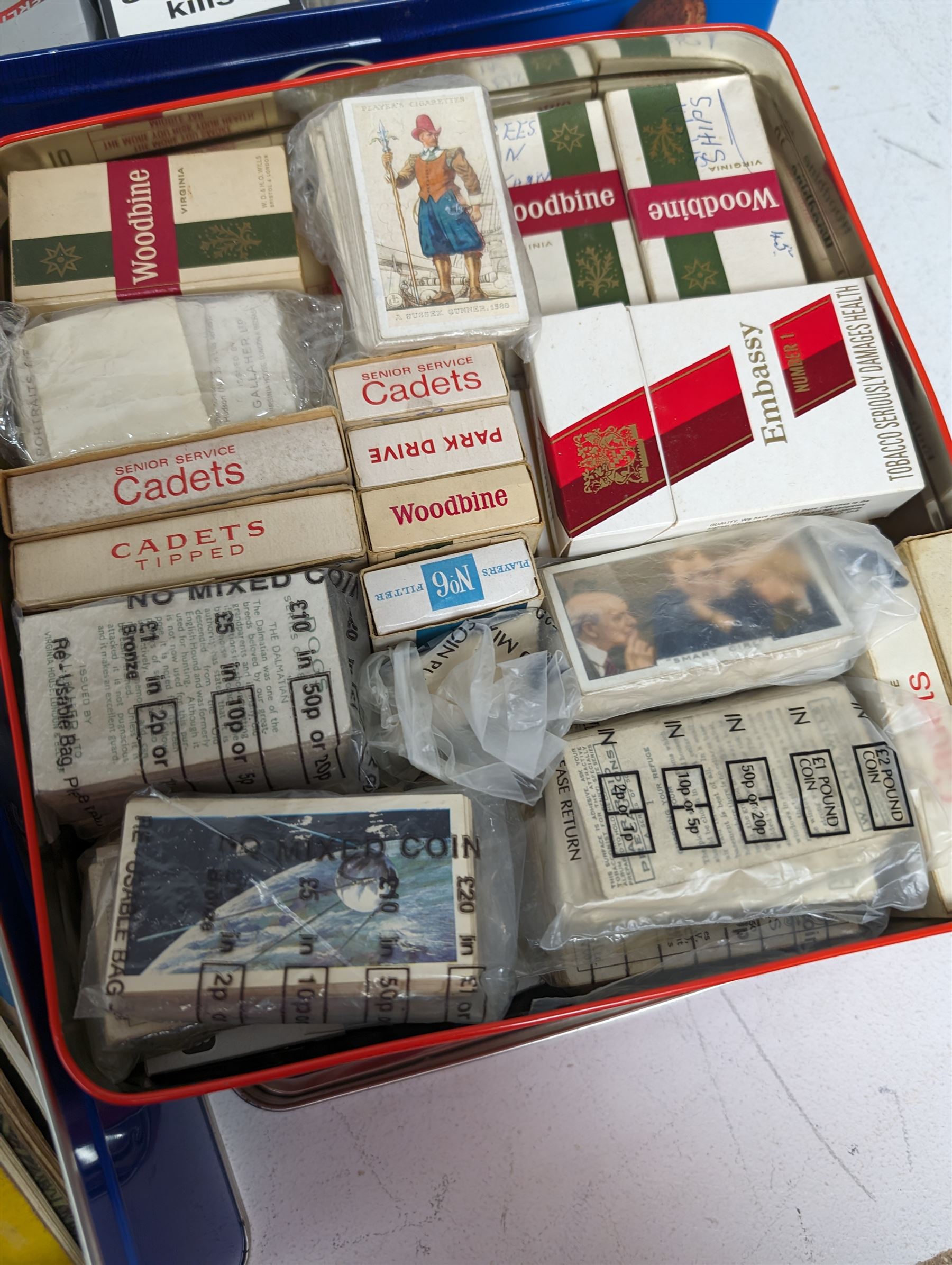 Large quantity of cigarette/tea cards, some loose and in albums, including Carreras, Bond, etc, contained within six tins, together with a Cricket How to Play book