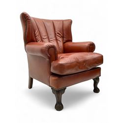 Georgian design barrel-back winged armchair, upholstered in rich mahogany leather, channel...