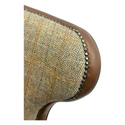 Wood Bros - contemporary wingback armchair, high back with curved wings upholstered in herringbone patterned fabric, accented with leather trim and brass nailhead studs, resting on cabriole front feet 