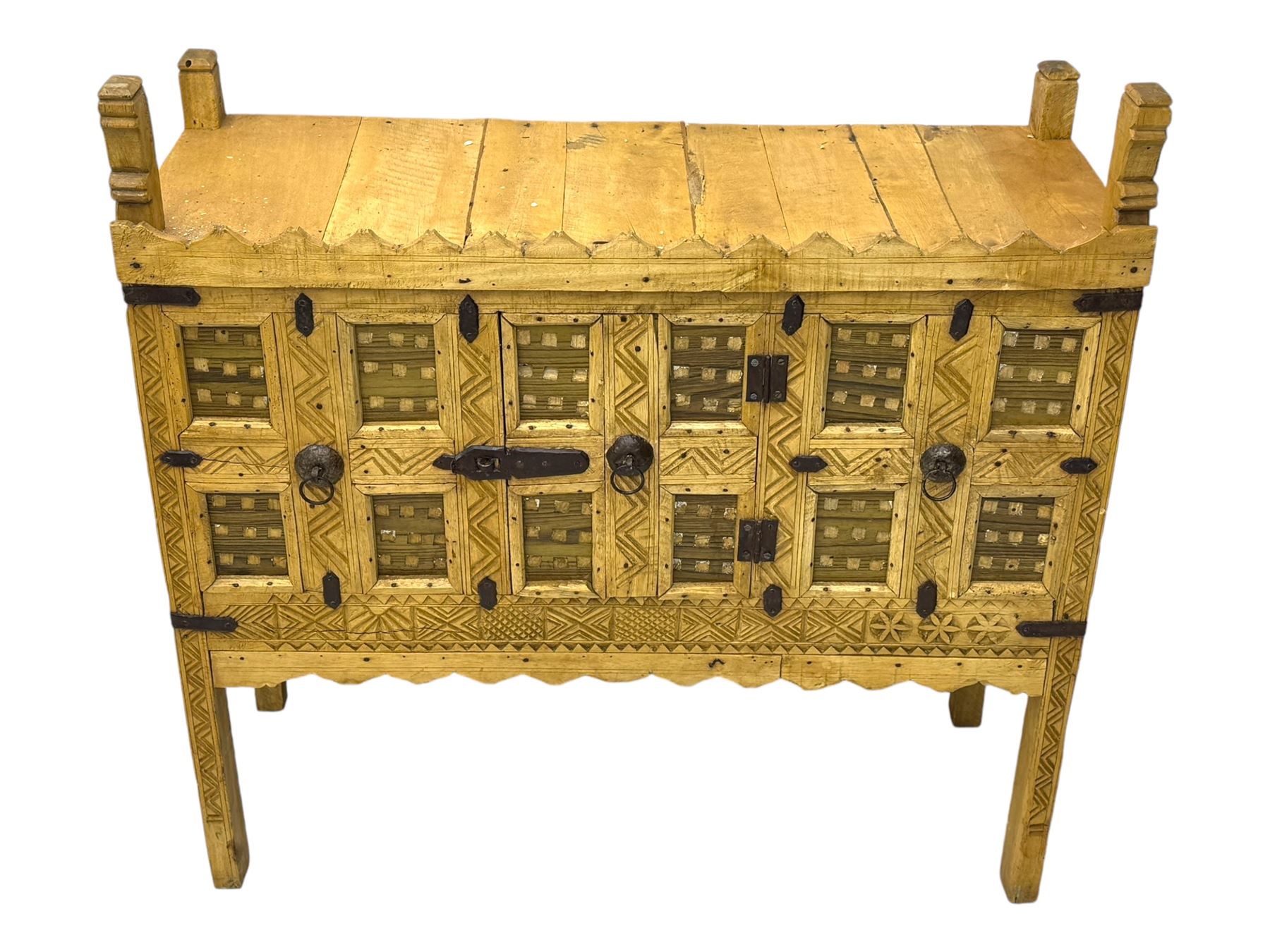 Late 19th century Indian teak damchiya chest, panelled front enclosed by single door, with metal bands and handles 