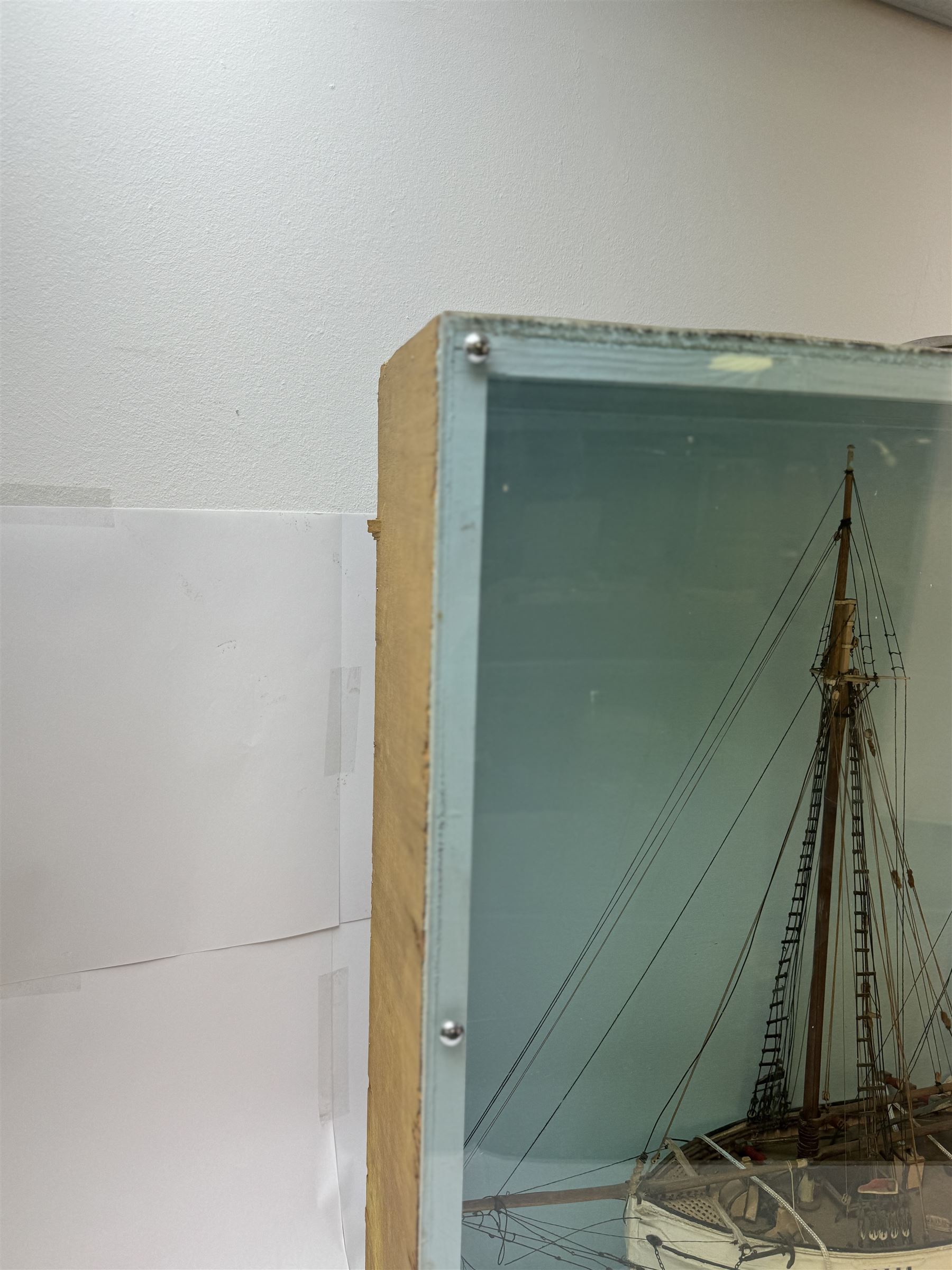 Scratch built model of a two-masted schooner, the red and white painted wooden body numbered GC-3-893, contained within wooden case, the interior painted in a light blue, with carry handle, excluding handle case H64.5cm, W67cm