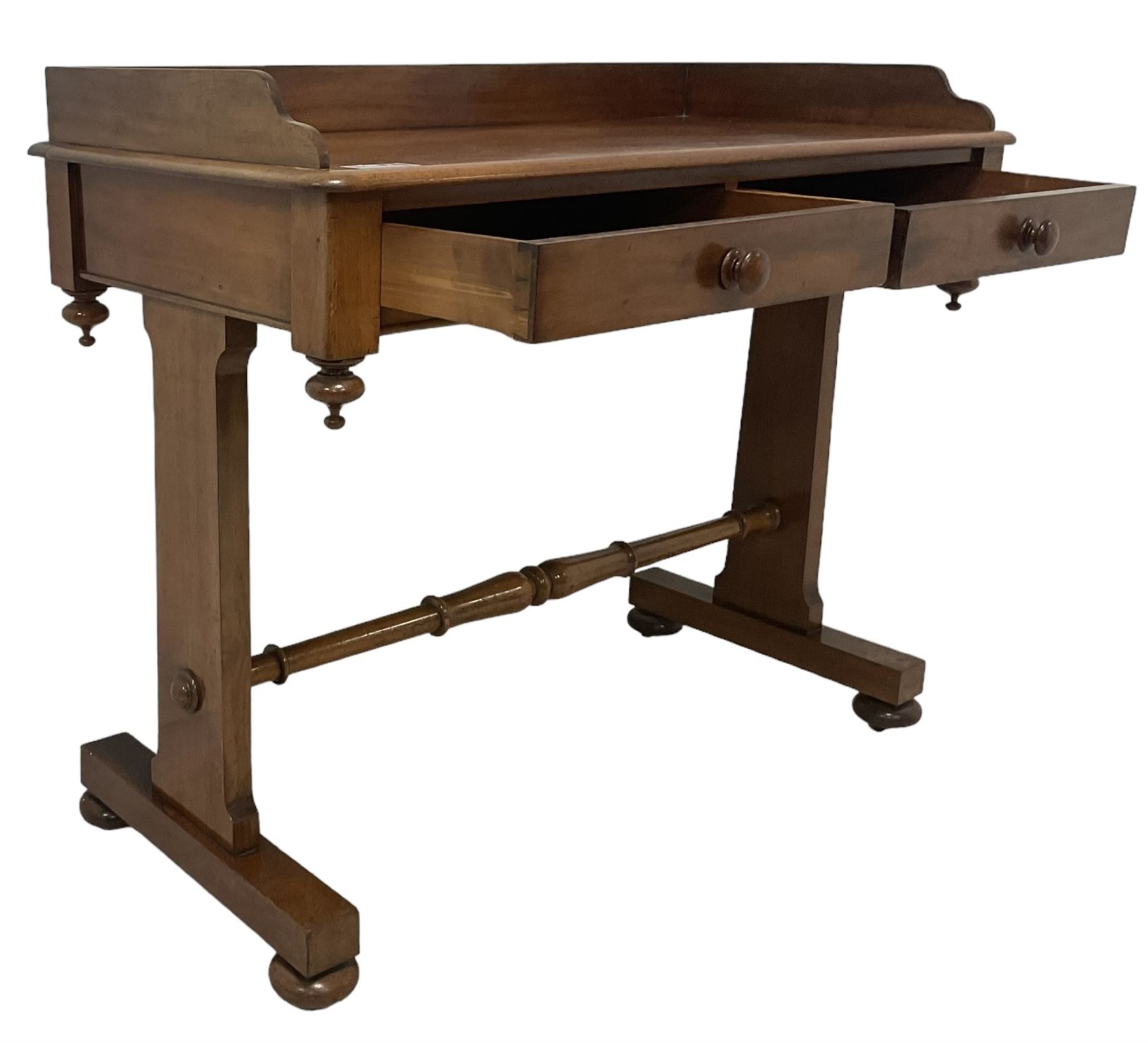 Victorian mahogany washstand, three-quarter raised gallery back, rectangular top with over two drawers, on shaped end supports united by ring-turned stretcher