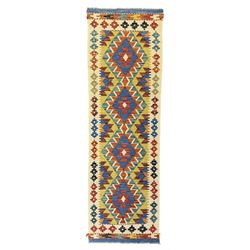 Kilim runner rug, central field decorated with four stacked geometric medallions in a multicoloured zigzag design, bordered by a series of small geometric motifs, fringed edges at both ends