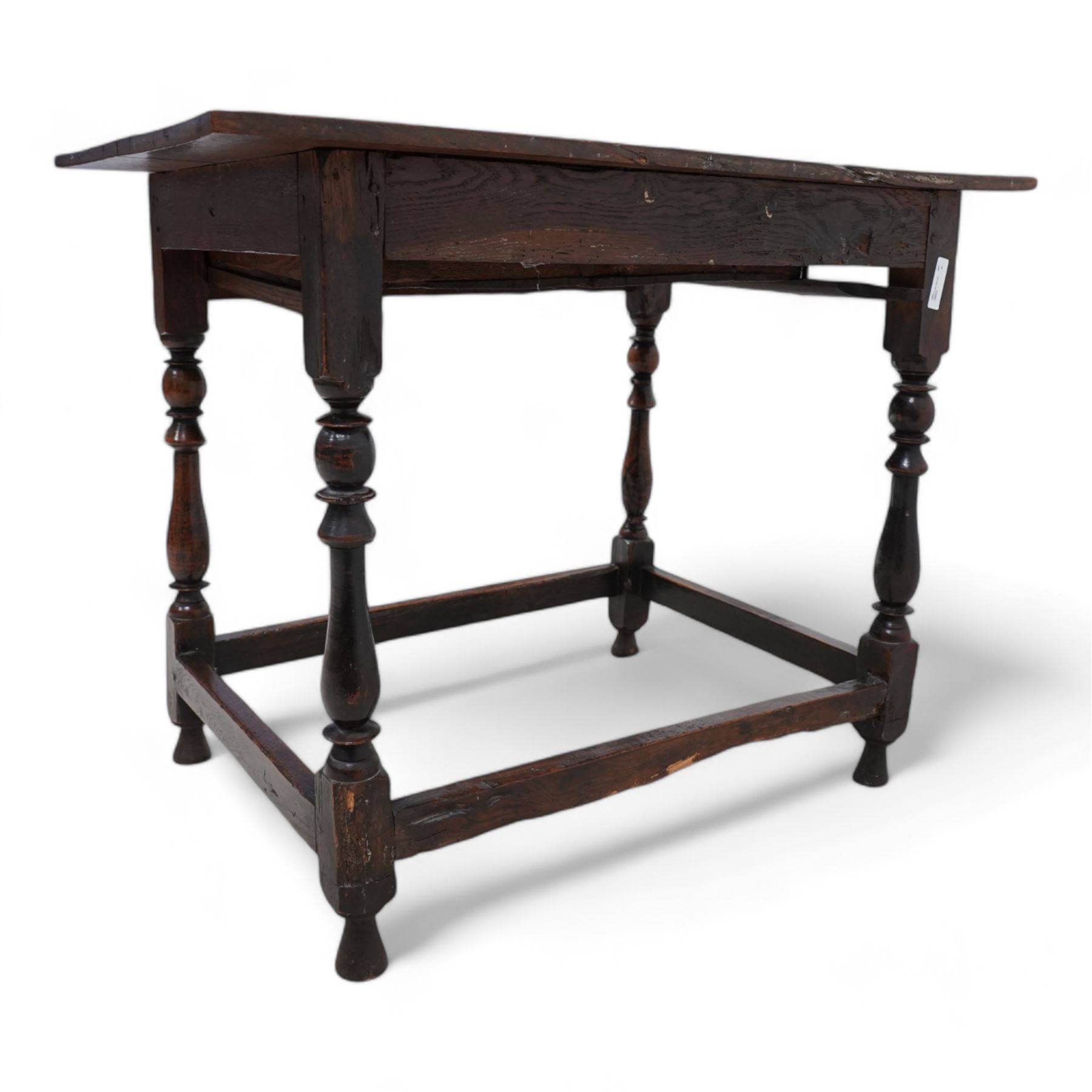 18th century oak side table, rectangular pegged two-plank top over singe drawer carved with S-scrolls, on turned supports united by plain stretchers 