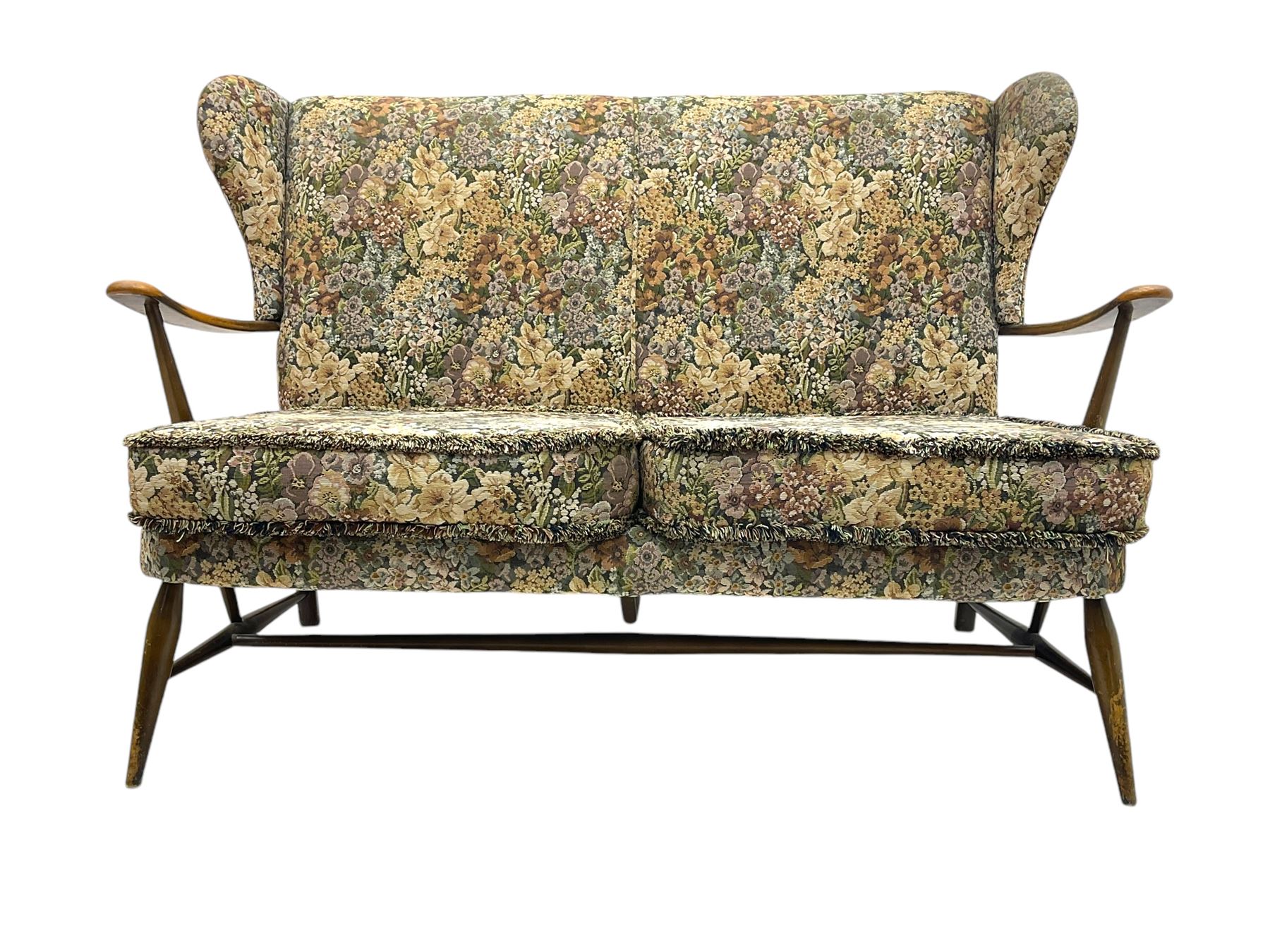 Lucian Ercolani for Ercol - mid-20th century beech and elm 'Windsor 203' two-seat sofa, wingback design upholstered in floral pattern over sprung seat and backrest, open curved arms, on splayed supports with stretchers (W133cm, D87cm, H90cm); matching easy chair (W70cm, D97cm, H82cm)