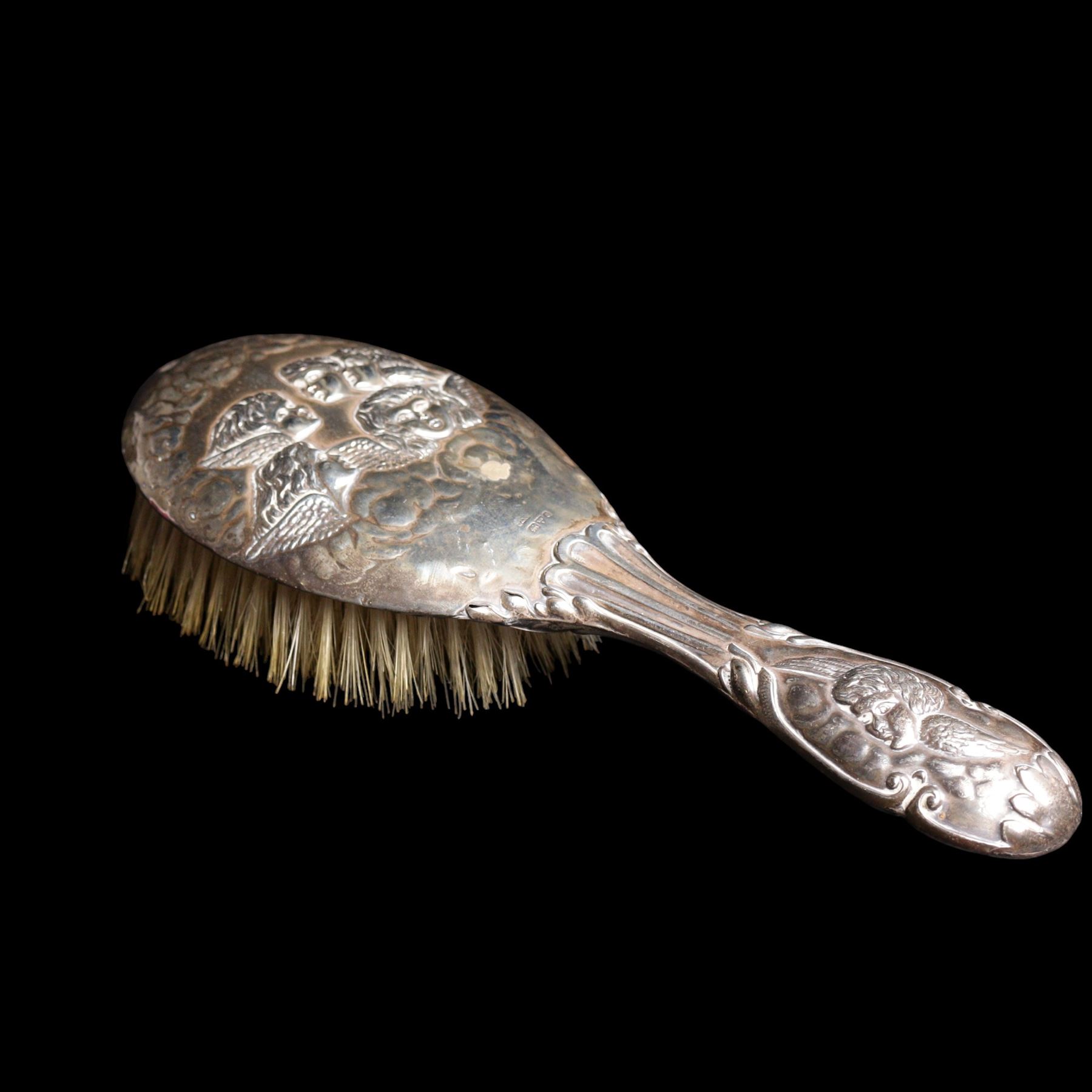 Silver navette shape bread basket with pierced sides, L28cm Chester 1900 Maker William Aitken, globe scent bottle with silver cover, glass dressing table jar with silver lid and a silver backed hairbrush 