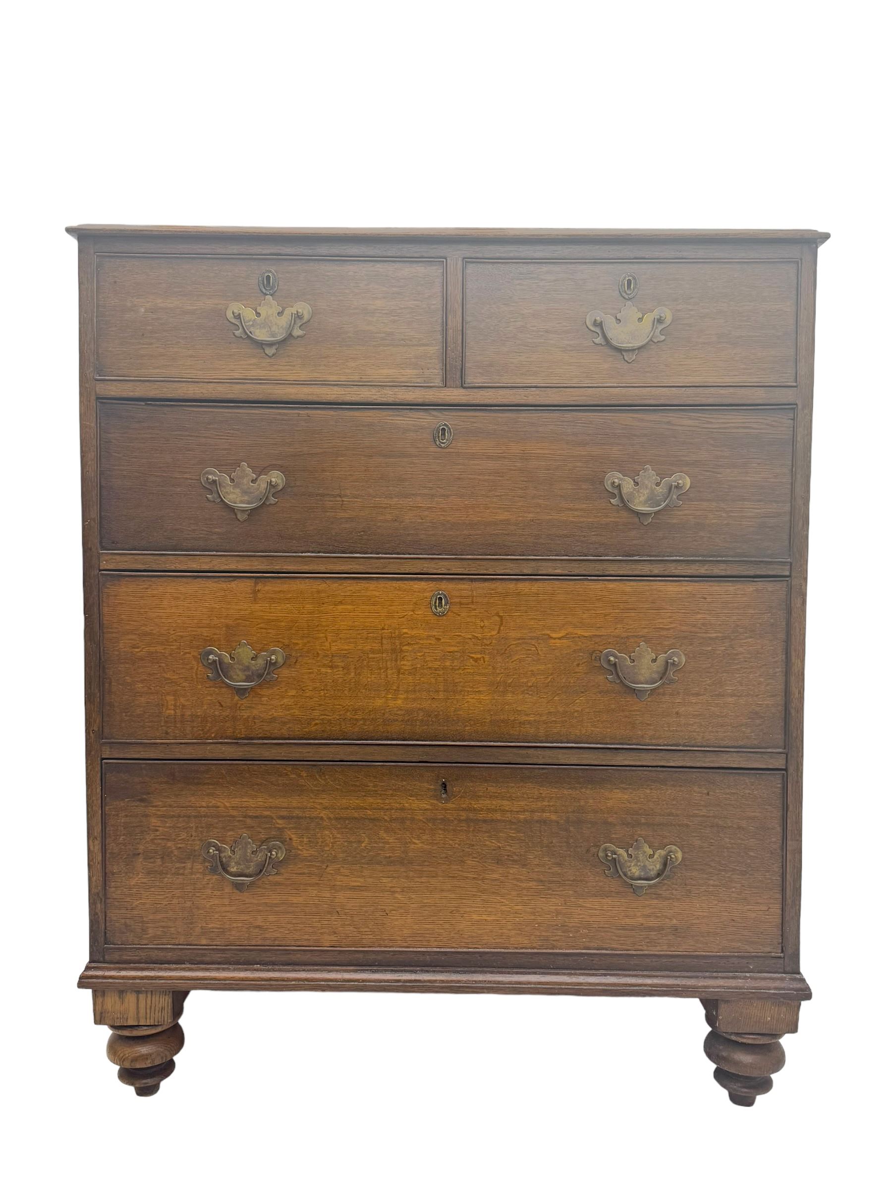 George III oak chest, rectangular top with moulded edge over two short and three long graduated drawers, each with brass escutcheons and shaped backplate handles, on turned bun supports 