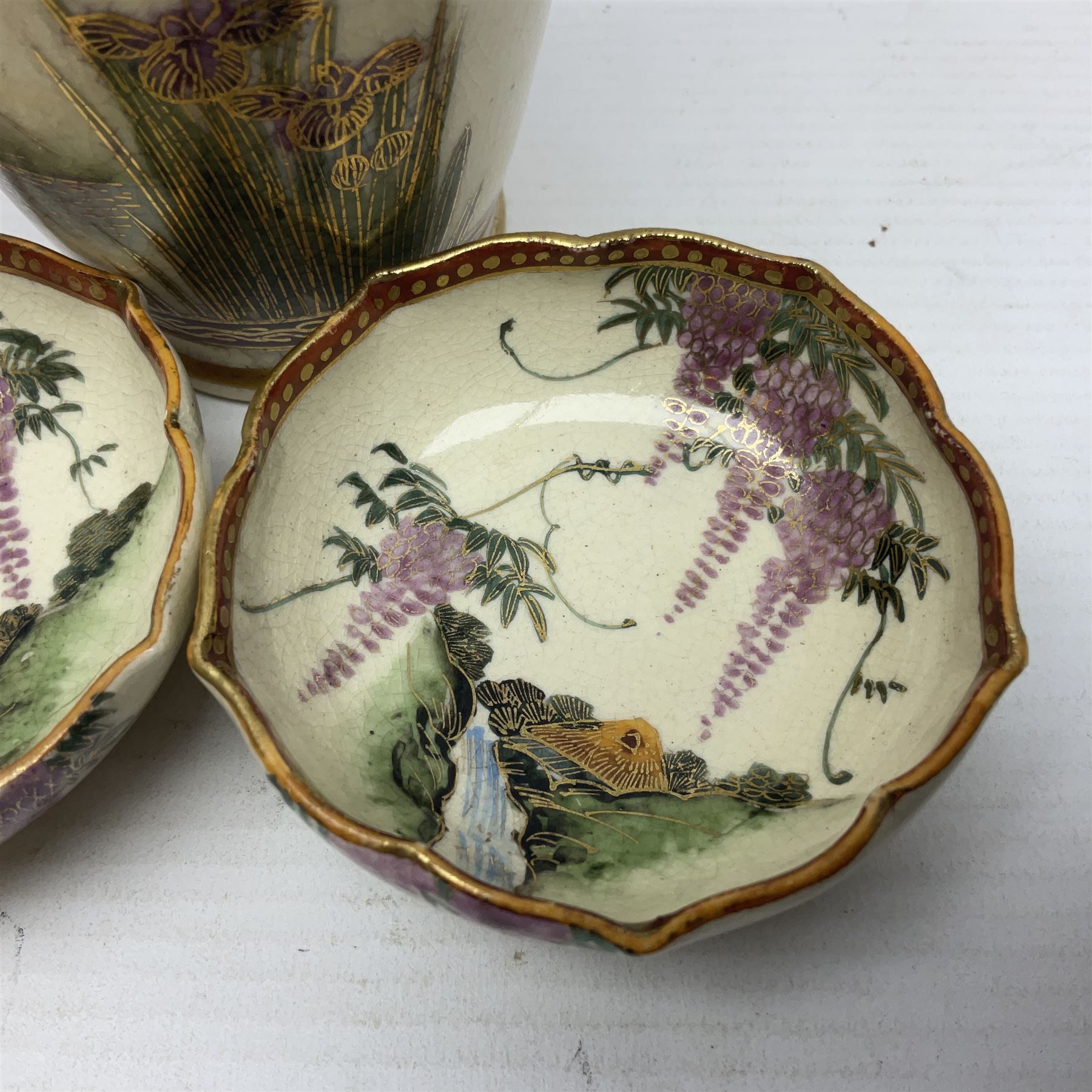 Japanese Satsuma Meiji period vase painted with a mountainous river landscape scene with wisteria and irises; together with a pair of similarly painted small dishes, signature beneath, vase H15cm