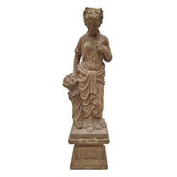 Hand carved stone Neoclassical figure of the Roman goddess Flora, her hair pinned with ros...