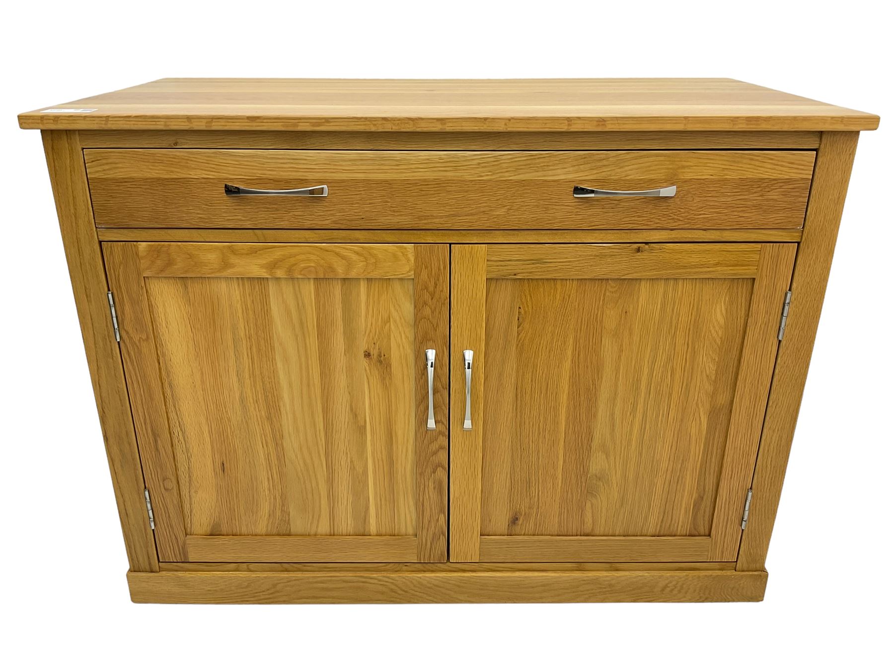 Contemporary light oak sideboard desk, rectangular top with full length drawer, hinged front panel revealing pull-out keyboard tray, over two panelled doors enclosing an assortment of shelves and compartments with cable management holes, on plinth base