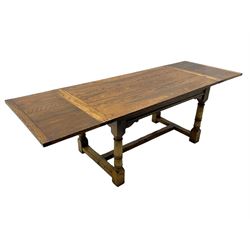 Oak refectory dining table, rectangular three plank top with cleated ends, two additional leaves, on turned supports united by H-stretchers 