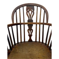 19th century yew wood and elm Windsor armchair, low double hoop stick and pierced splat back, dished seat on turned supports united by crinoline stretchers