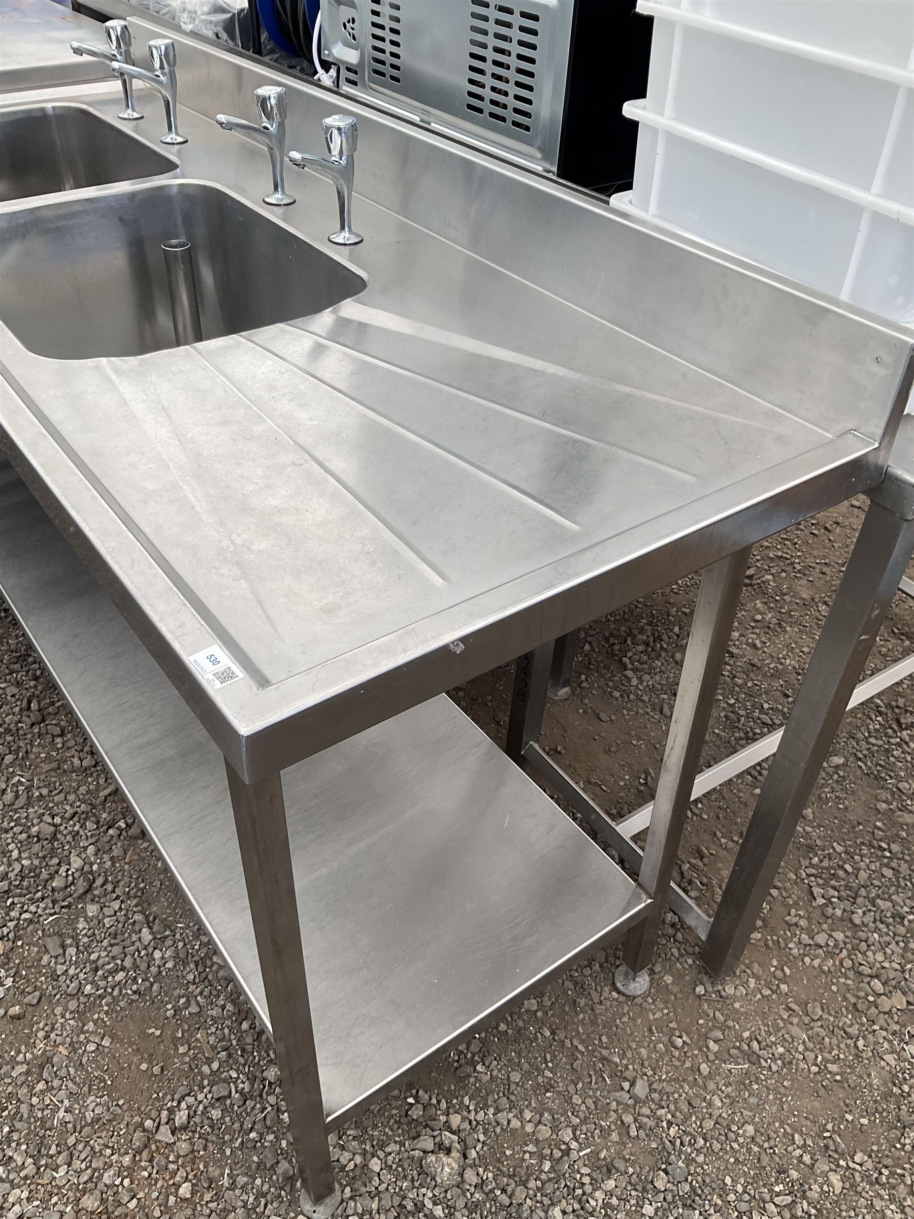 Commercial stainless steel double sink and drainer, hot and cold taps, under-tier shelf, two waste barrel plugs - THIS LOT IS TO BE COLLECTED BY APPOINTMENT FROM DUGGLEBY STORAGE, GREAT HILL, EASTFIELD, SCARBOROUGH, YO11 3TX