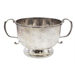 Late Victorian silver twin handled bowl, of plain circular form with two C scroll handles, upon a circular foot, hallmarked John Edward Wilmot, Birmingham 1897, including handles H8cm