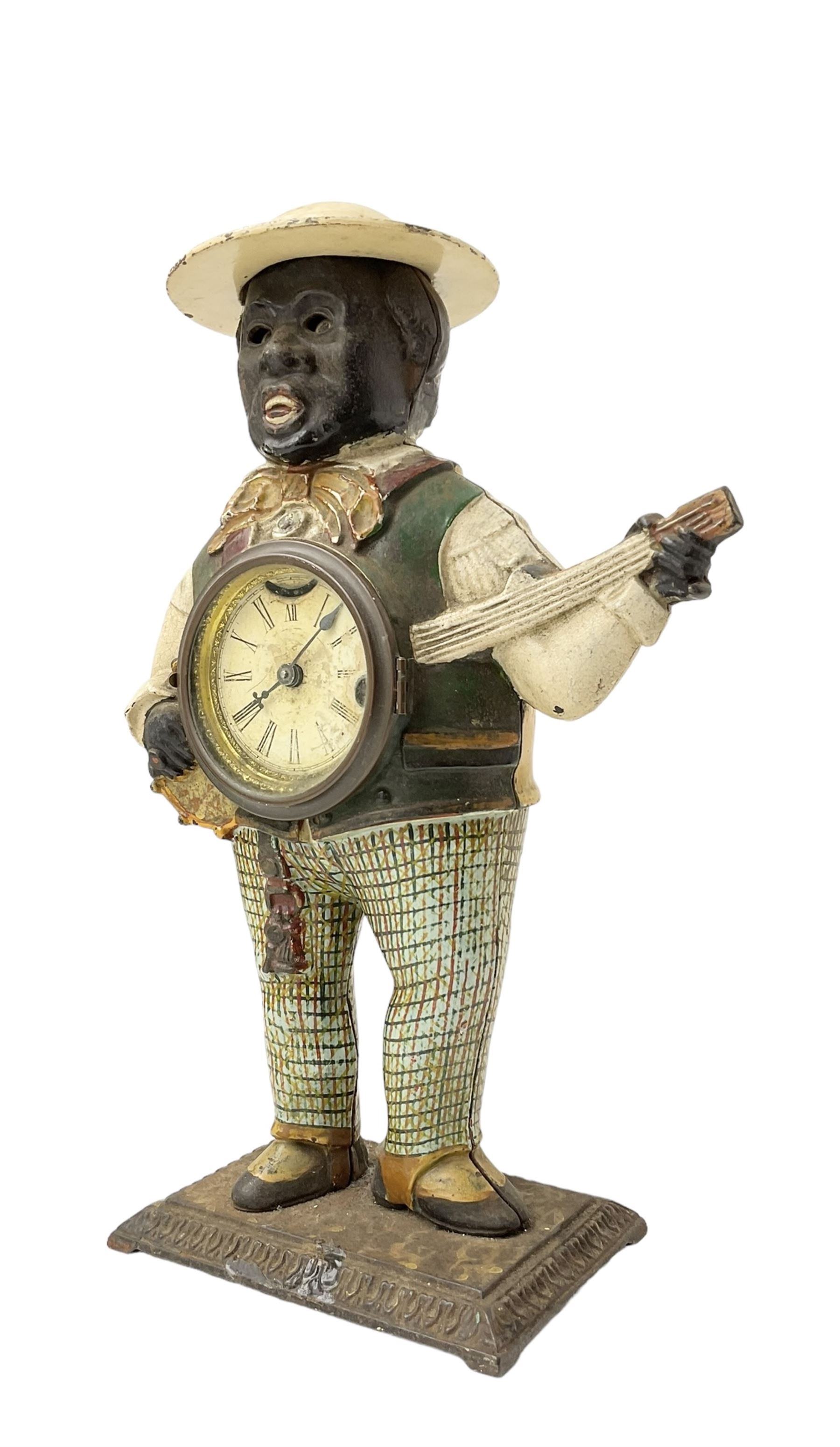 American  - Blinking-eye cast iron 30-hour banjo clock with a key wound spring driven movement and pin pallet escapement, dial bezel stamped 