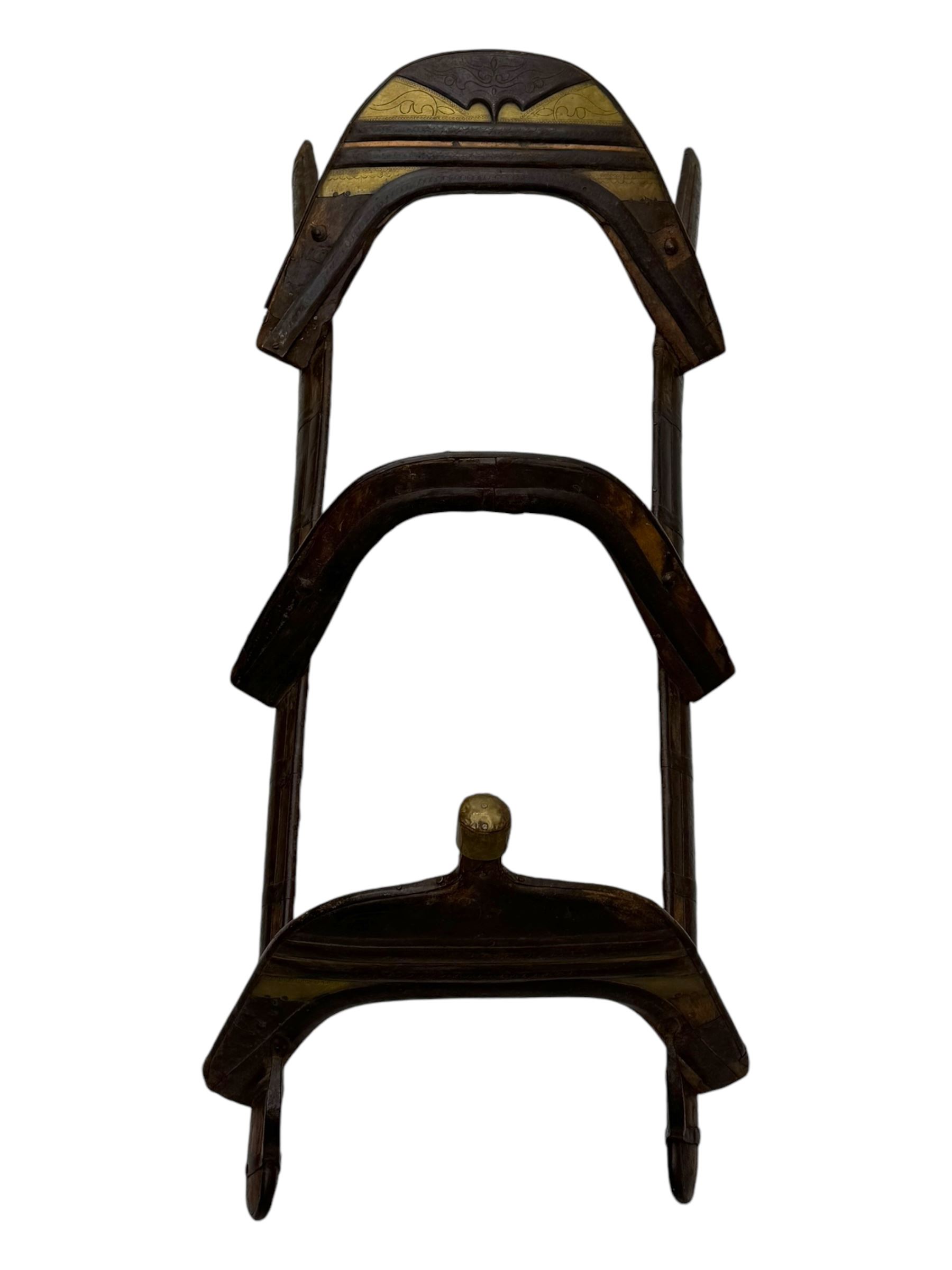 Late 19th to early 20th century hardwood and metal mounted camel saddle 