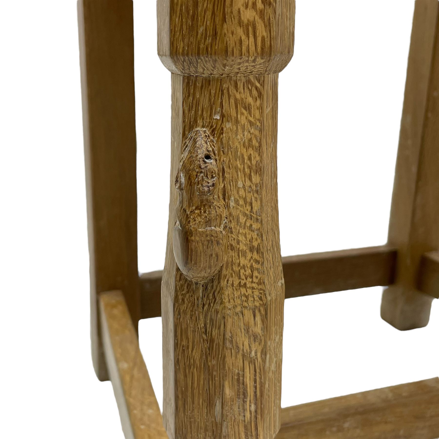 Mouseman - set of six oak dining chairs, pierced and carved lattice panel back over tan leather seat with studded band, on octagonal front supports united by plain H stretchers, carved with mouse signature, by the workshop of Robert Thompson, Kilburn 