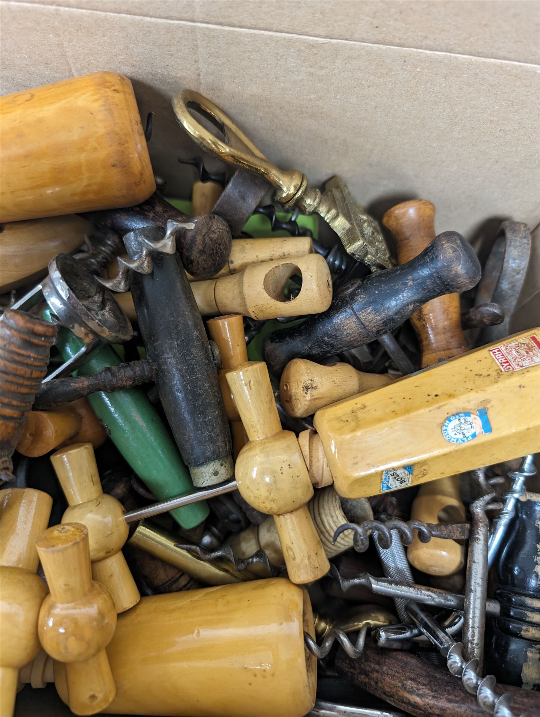 Collection of approximately fifty seven corkscrews, including turned wooden and metal examples