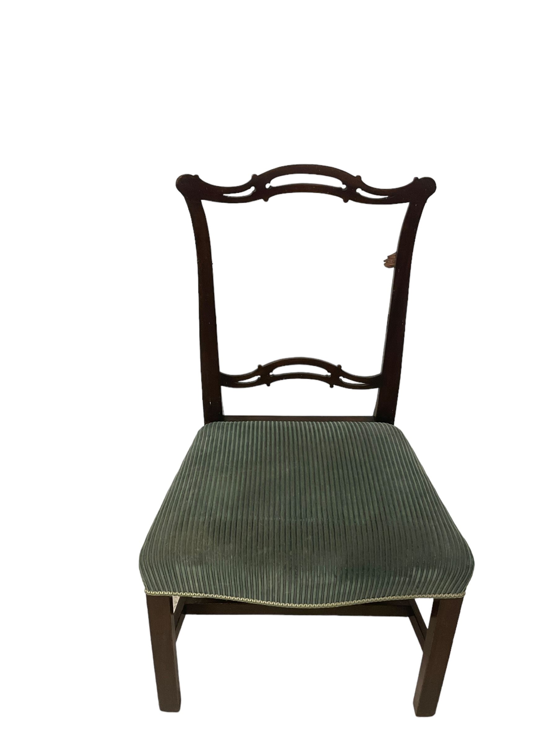 Set of twelve (10+2) Chippendale revival stained beech dining chairs, pierced waived ladder backs with over-stuffed over seats, on square moulded supports joined by stretchers