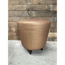 Four circular tapered stools, upholstered in gold fabric