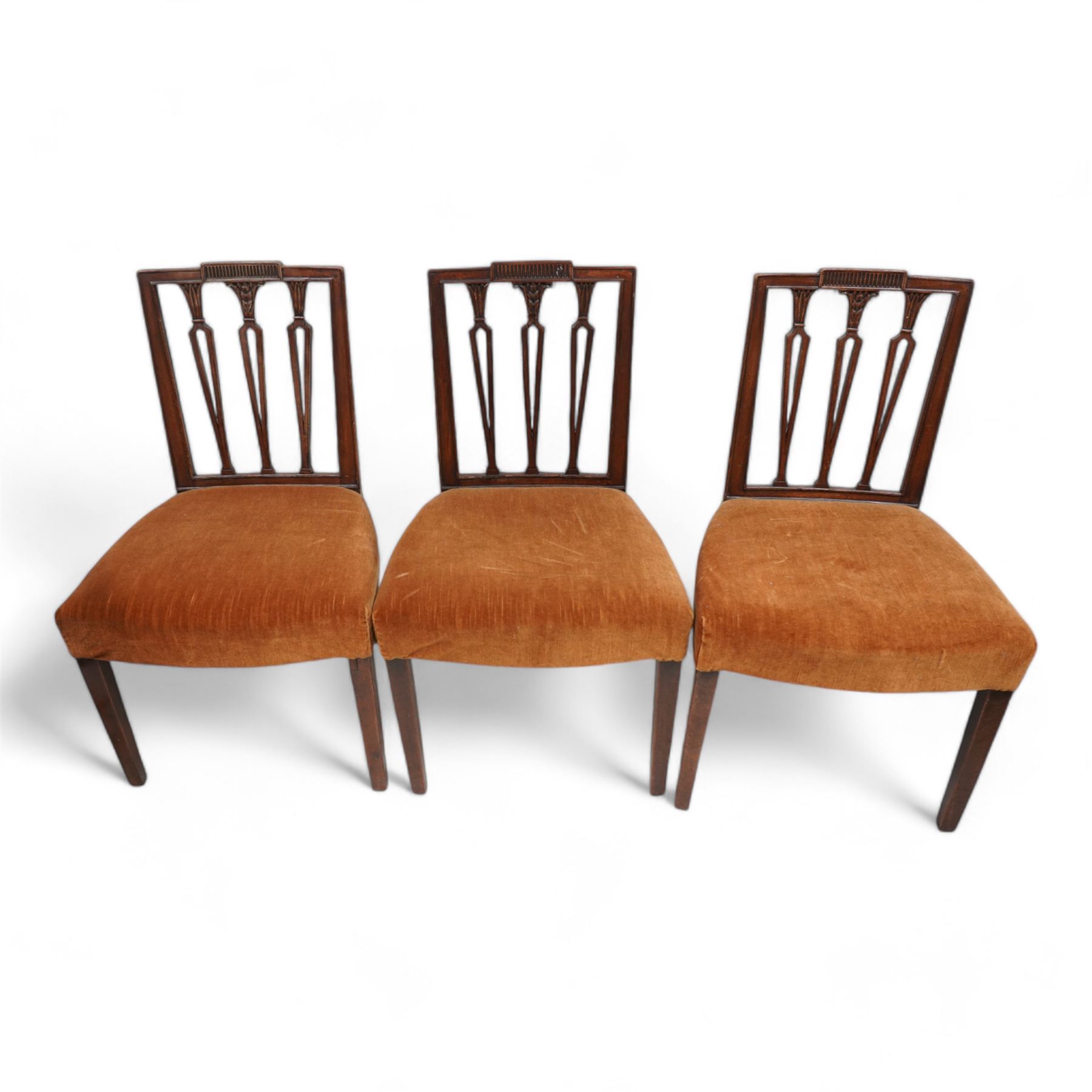 Set of three Edwardian mahogany dining chairs, fluted cresting rail over shaped and pierced vertical slats with foliate carved capitals, upholstered in mustard fabric, on square tapering supports (H89cm, W53cm); Edwardian satinwood inlaid mahogany open armchair, interlacing oval back over shaped arms, on square tapering supports with spade feet (W56cm, H91cm); 20th century pair of Hepplewhite Revival mahogany dining chairs (W52cm, H97cm) (6)