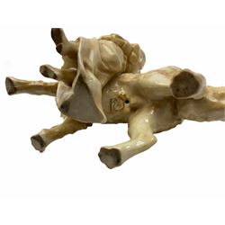 Late 19th/early 20th century German porcelain figure group, modelled as a Great Dane with young girl stood at their side, marked beneath with RW within lozenge surmounted by a crown, and impressed number, H15cm
