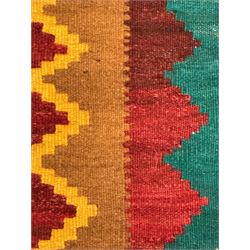 South West Persian Qashqai Kilim, crimson ground and decorated with three rows of geometric motifs, within zig-zag borders 