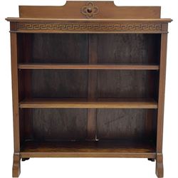 Early 20th century mahogany open bookcase, raised shaped back over rectangular moulded top, fitted with two shelves