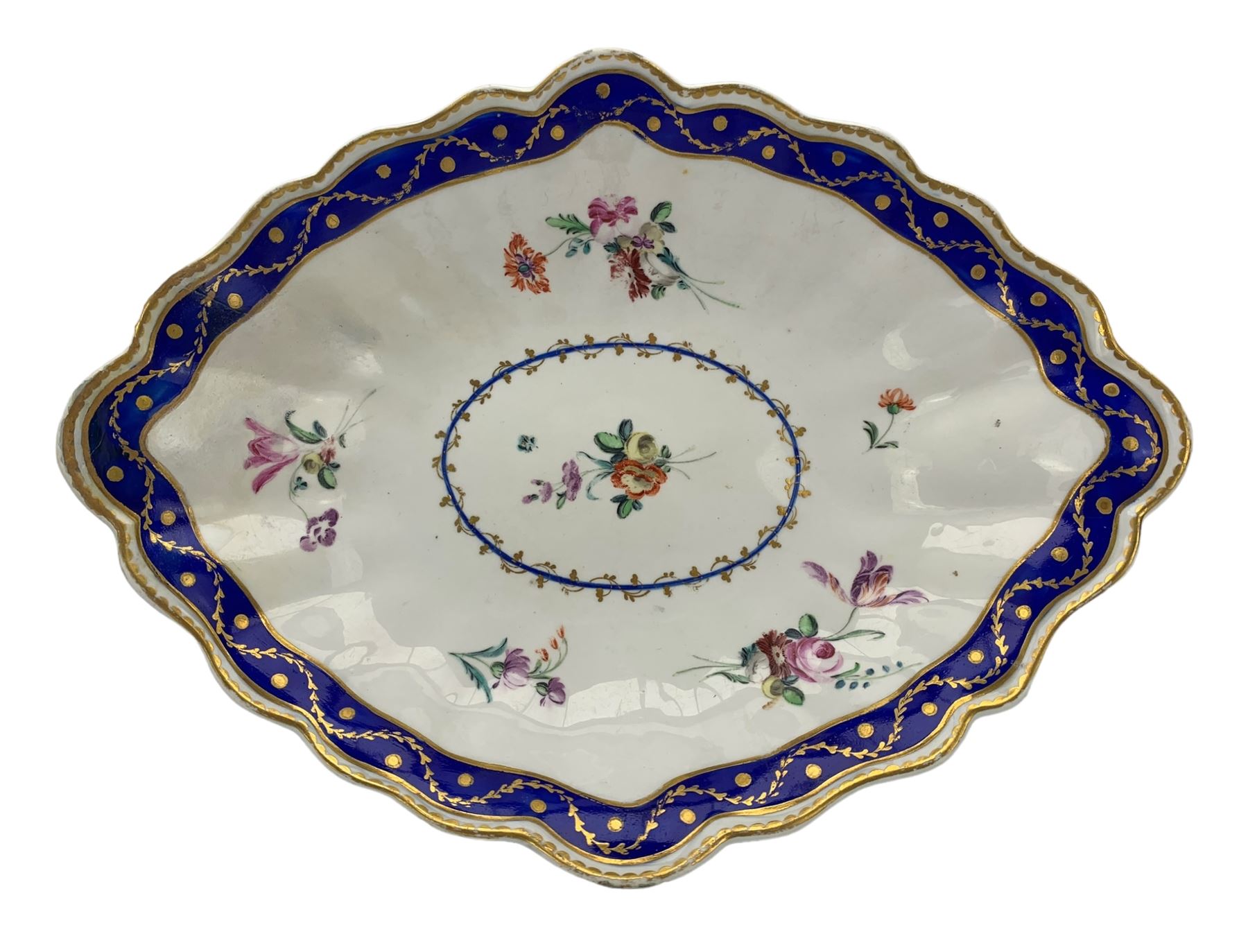 18th century Derby fluted lozenge shaped dish, in the manner of Edward Withers, painted with flower sprays within a blue and gilt leafy chain border, crown over D in blue, incised N, L26cm 